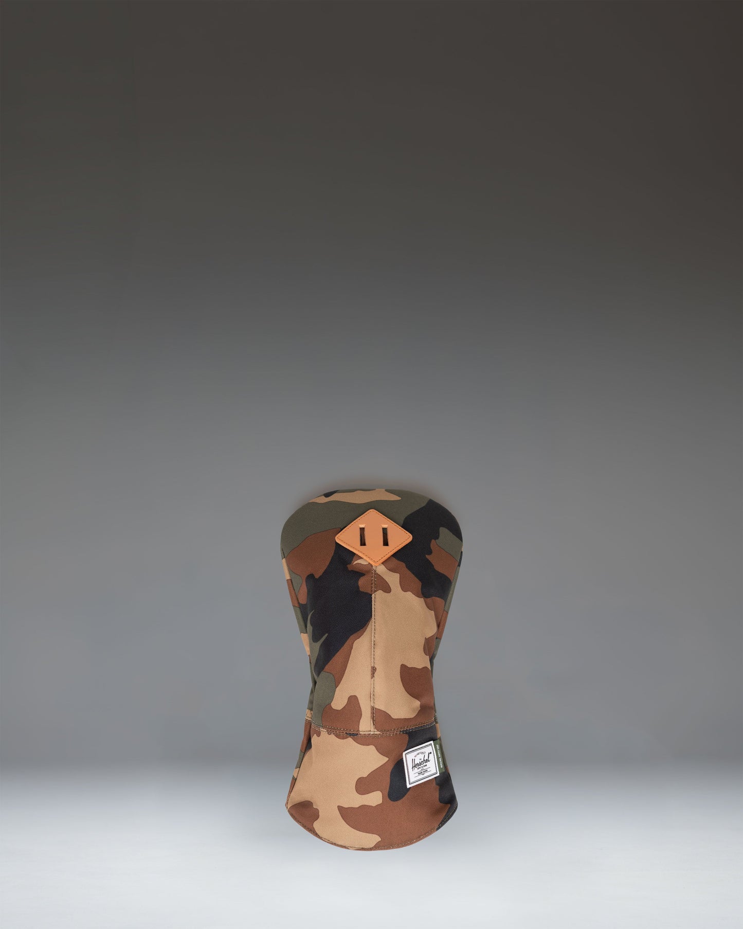 Herschel Heritage Driver Head Cover in Woodland Camo, featuring a classic camouflage pattern and signature diamond detail.