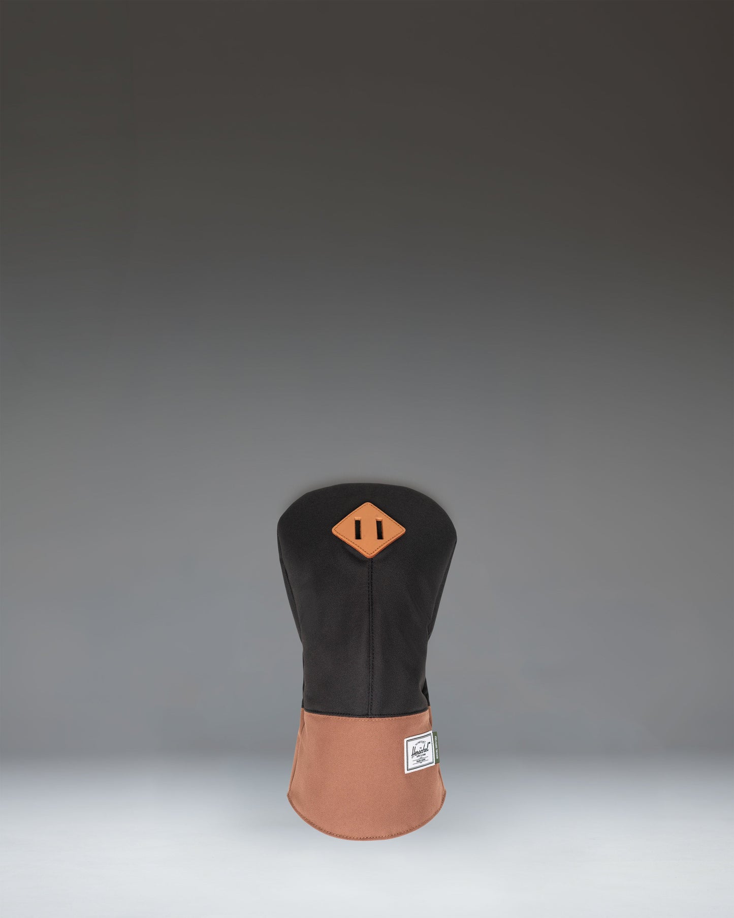 Herschel Heritage Driver Head Cover in Black and Saddle Brown, showing a classic design with a synthetic leather bottom and fabric top.