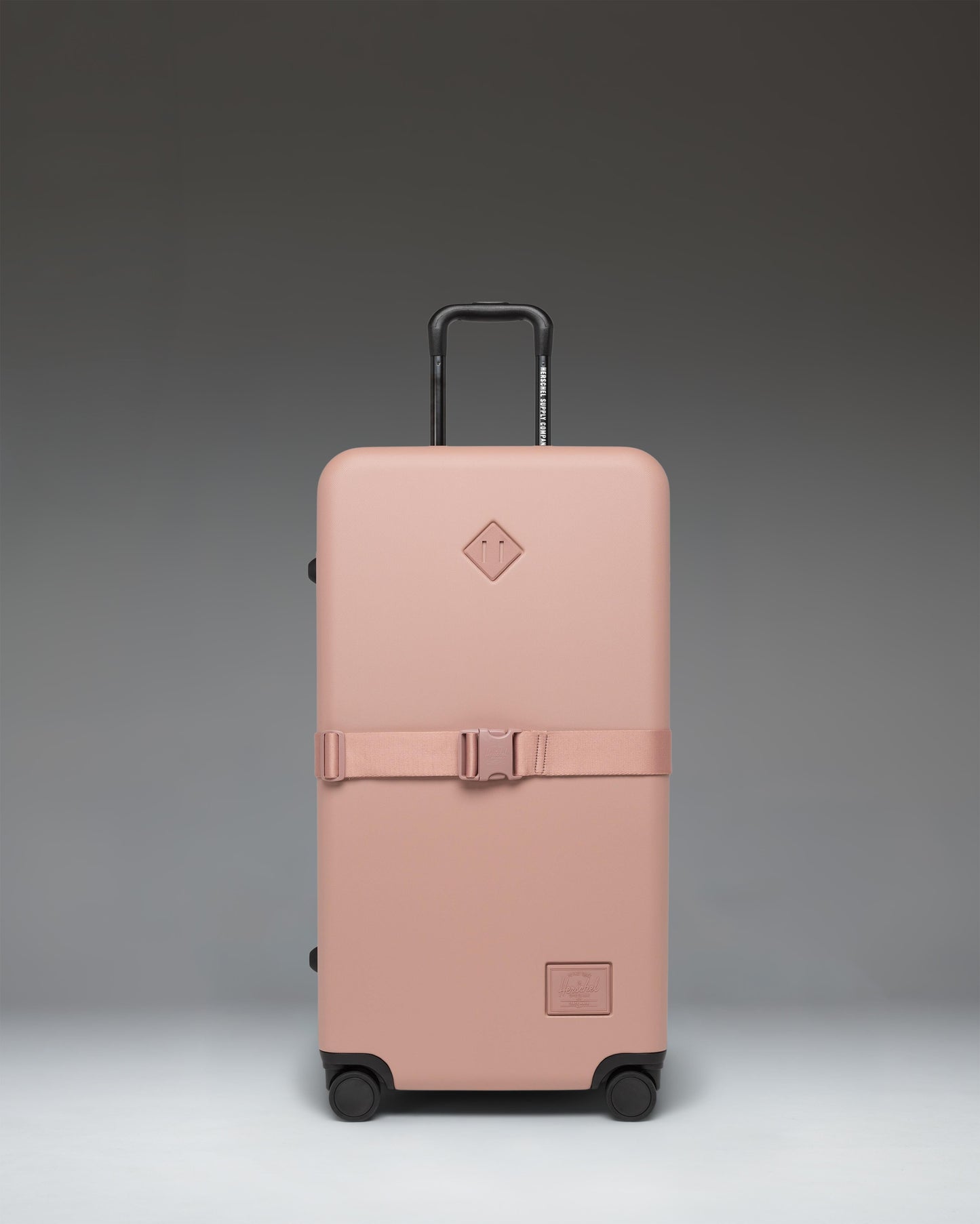 Herschel Heritage Hardshell Large Luggage Exp in Ash Rose, showing a durable pink hardside suitcase.