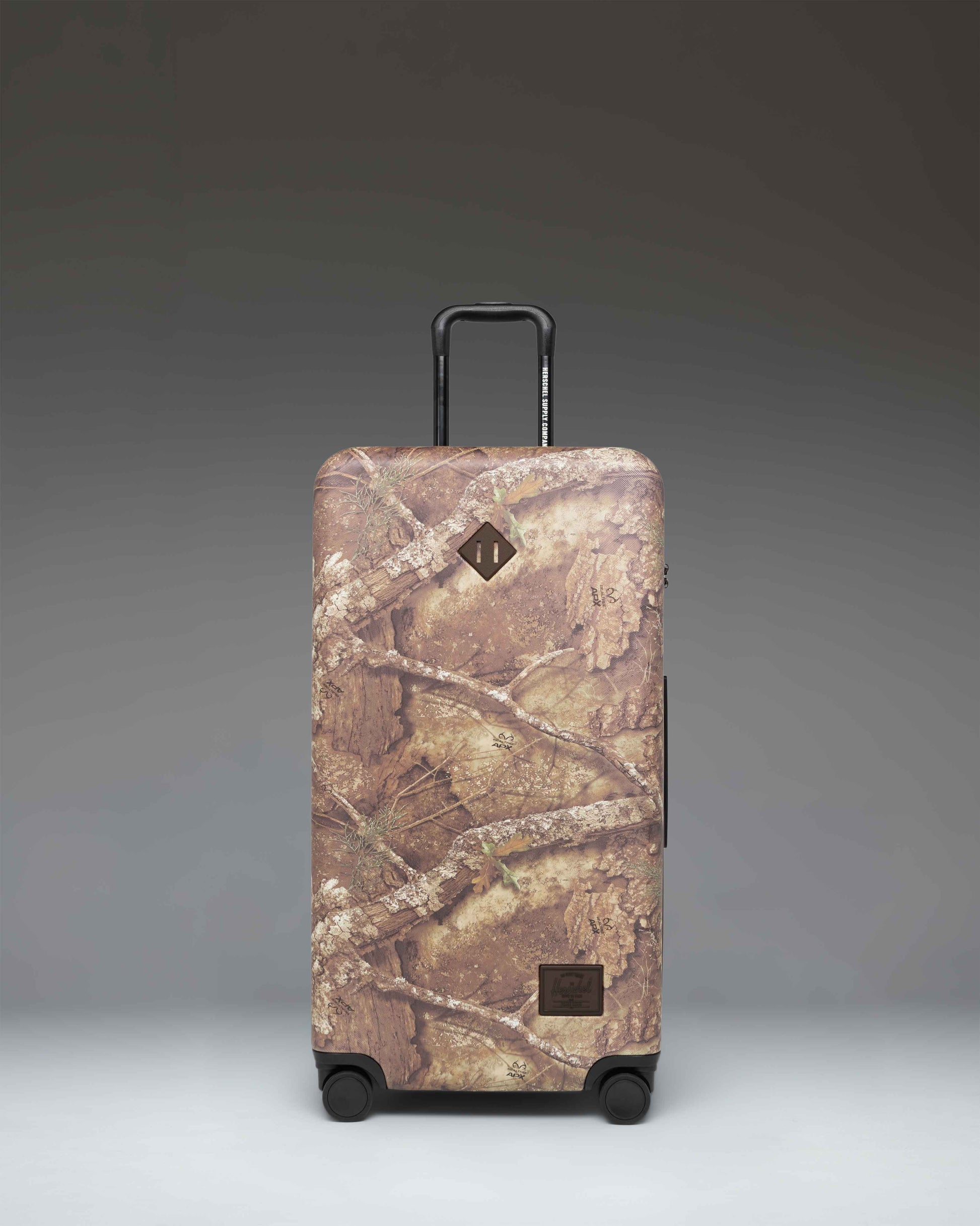 Realtree Herschel Heritage Large Luggage in Realtree APX Camo.