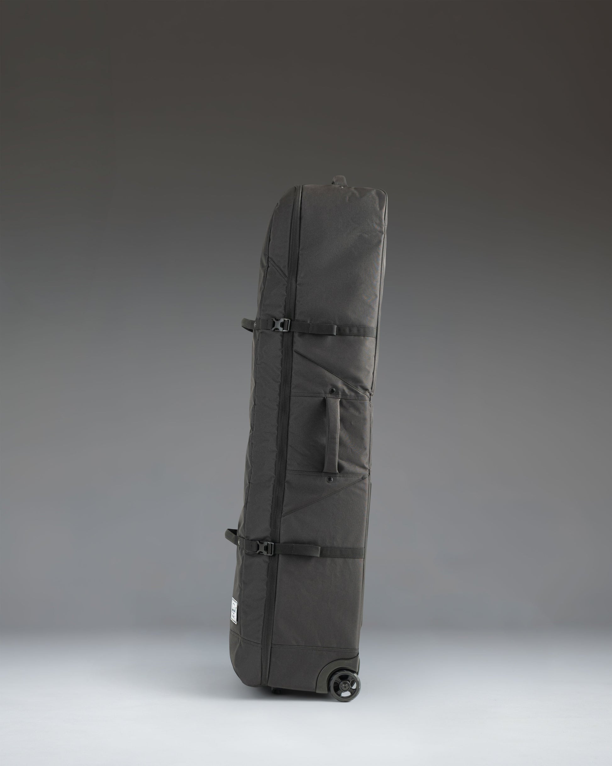 Herschel Heritage Golf Travel Wheelie Bag in black.