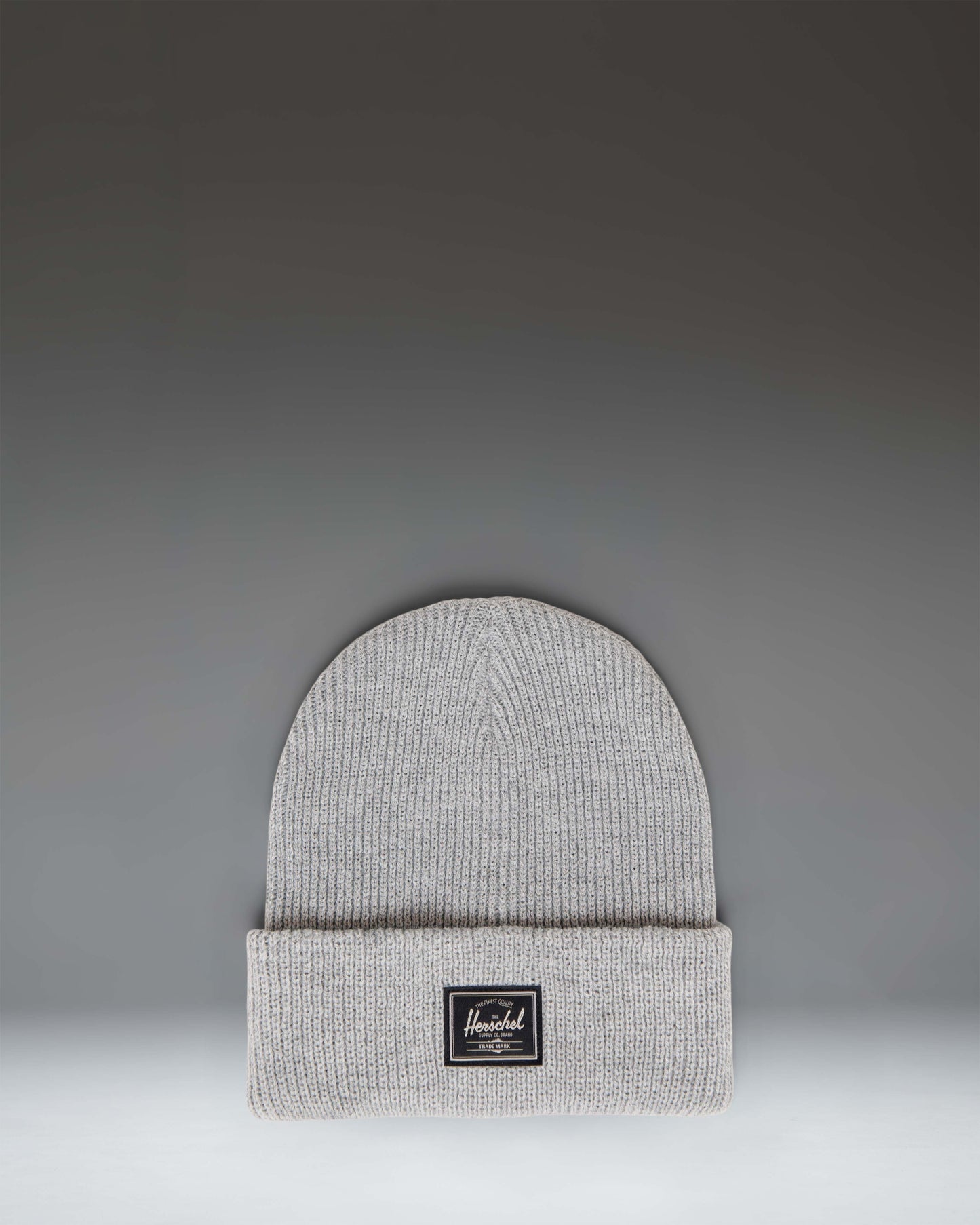Herschel Supply Co. Elmer Reflective Ribbed Beanie in Heather Light Grey Reflective, featuring a classic cuffed design and woven logo label.