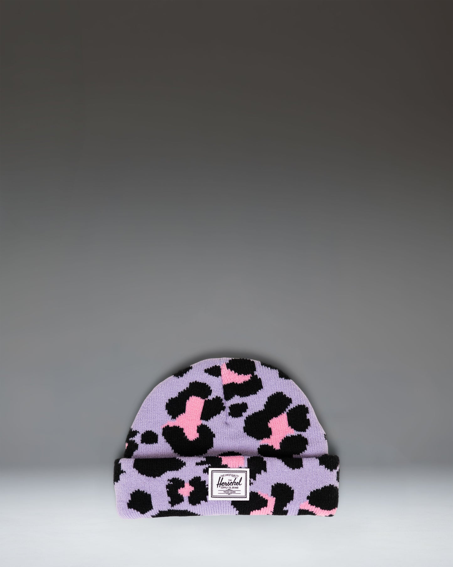 Herschel Supply Co. Elmer Baby Graphic Beanie 0–6 Months in Scribble Leopard Sachet Pink, featuring a pink knit hat with a black leopard print.