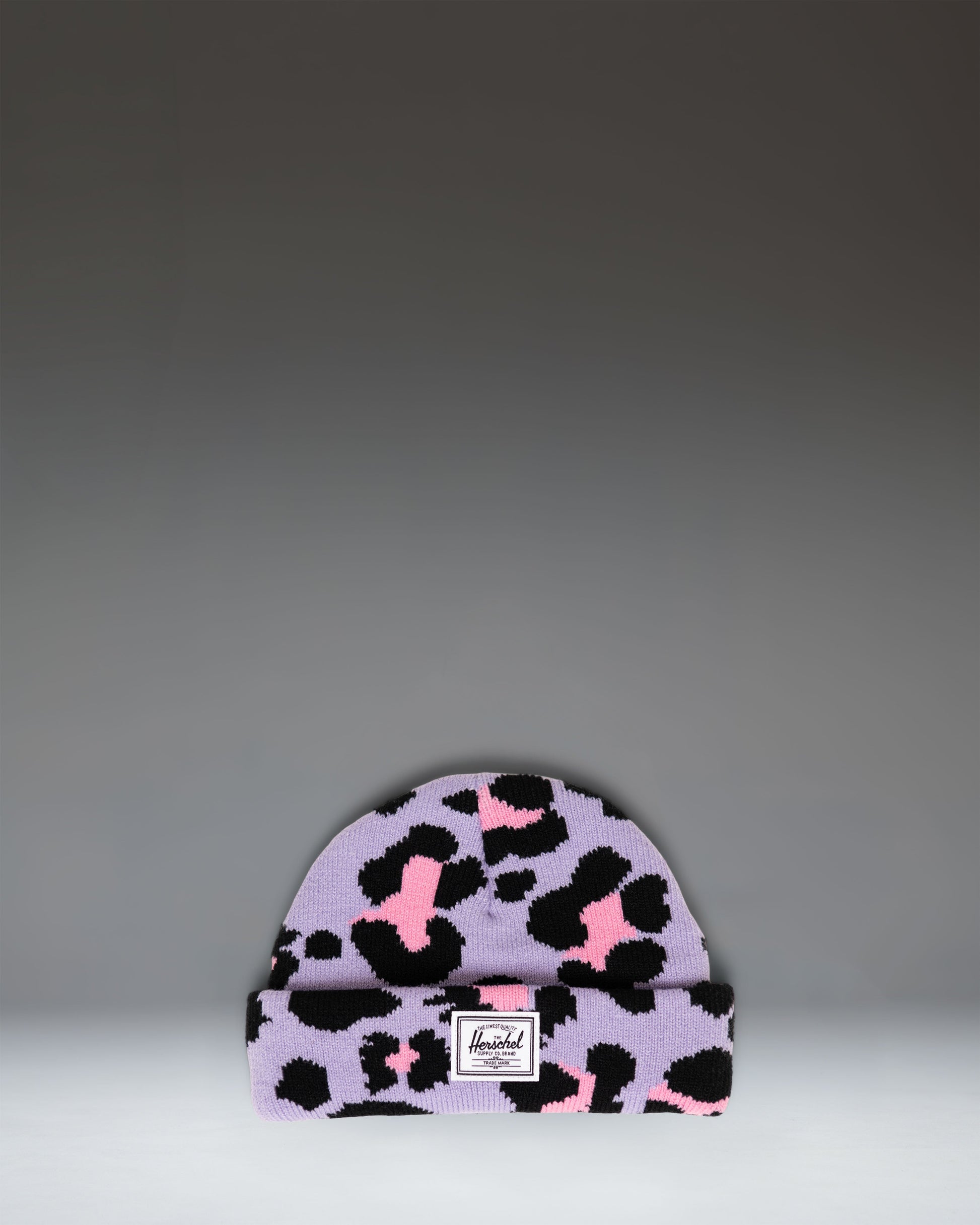 Herschel Supply Co. Elmer Baby Graphic Beanie 0–6 Months in Scribble Leopard Sachet Pink, featuring a pink knit hat with a black leopard print.