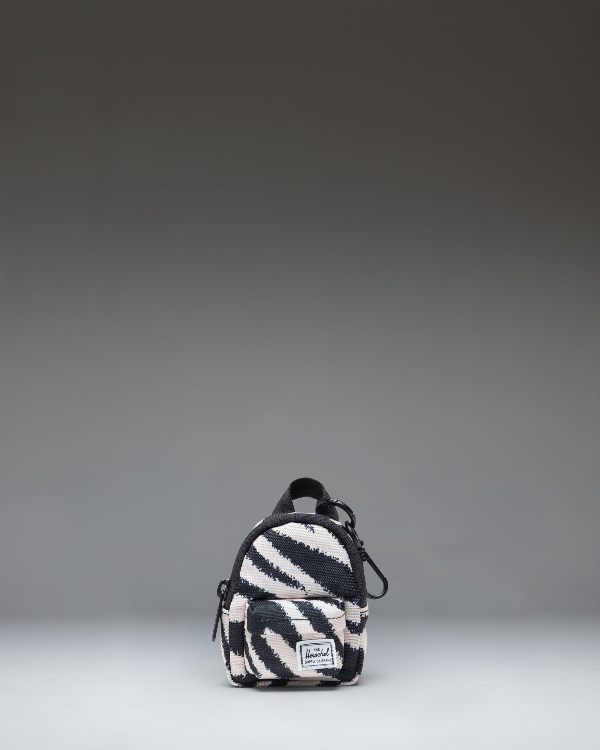Herschel Classic Backpack Bag Charm in a striking black and white zebra print pattern.